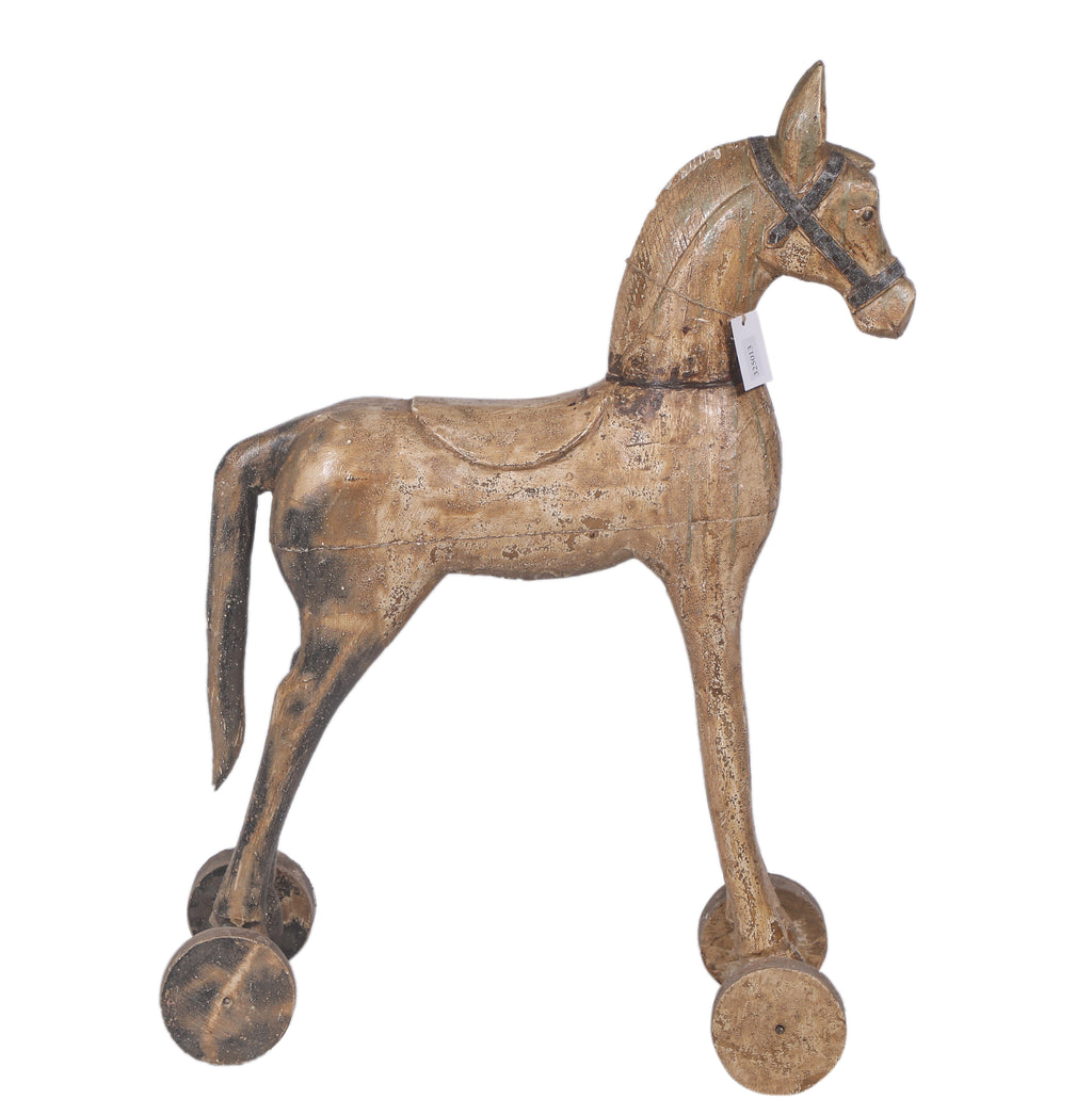 Cheval ancien sur roulettes en bois sculpté